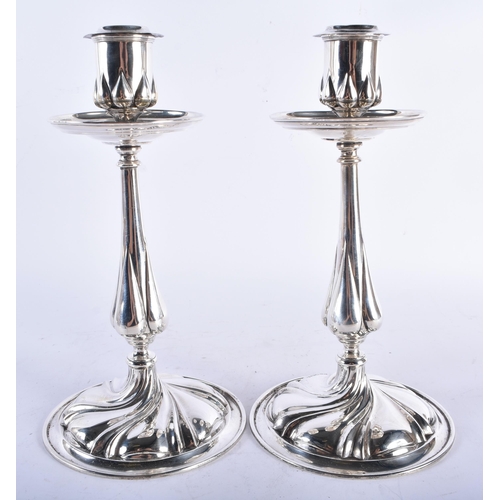 263 - A PAIR OF SILVER CANDLESTICKS. Birmingham 1953. 651 grams overall. 18 cm x 10 cm.