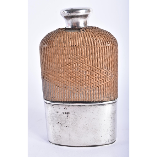 279 - AN ANTIQUE SILVER MOUNTED HIP FLASK. Weighable silver 102 grams. 15.25 cm x 9 cm.