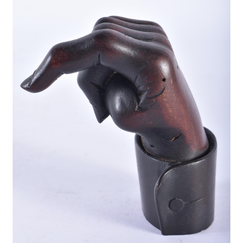 289 - AN EARLY 19TH CENTURY ENGLISH TREEN CARVED WOOD CLENCHED HAND. 9 cm x 5 cm.