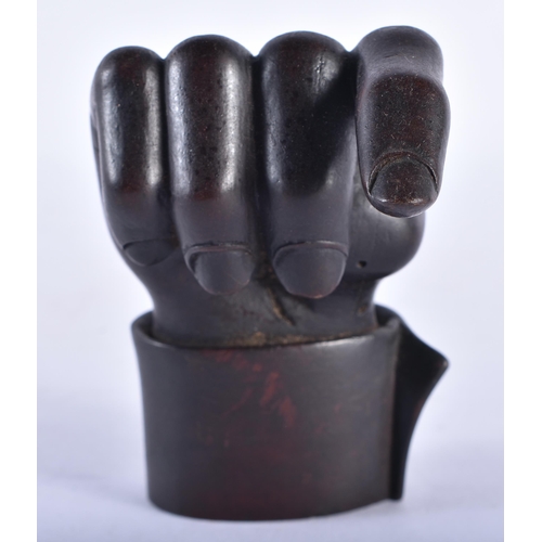 289 - AN EARLY 19TH CENTURY ENGLISH TREEN CARVED WOOD CLENCHED HAND. 9 cm x 5 cm.