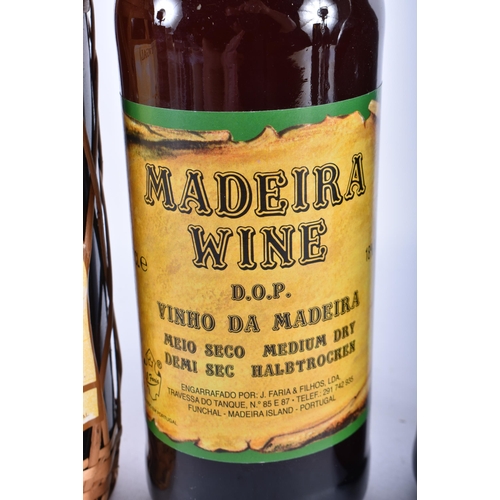 342 - TWO MADEIRA WINE BOTTLES and two bottles of port. (4)