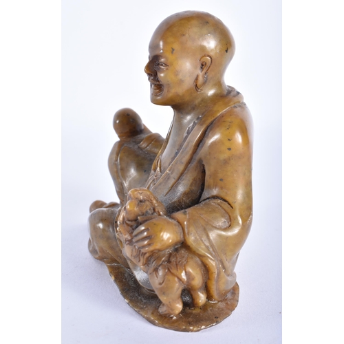 349 - A CHINESE QING DYNASTY CARVED SOAPSTONE FIGURE OF LUOHAN. 12 cm x 8 cm.