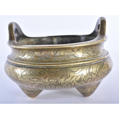 350 - AN UNUSUAL CHINESE QING DYNASTY TWIN HANDLED BRONZE CENSER decorated with buddhistic emblems. 12.5 c... 