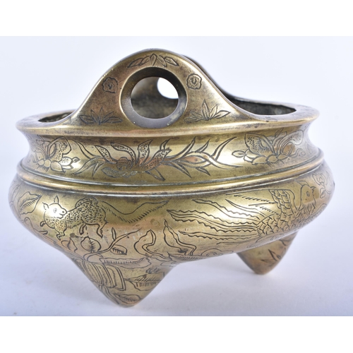 350 - AN UNUSUAL CHINESE QING DYNASTY TWIN HANDLED BRONZE CENSER decorated with buddhistic emblems. 12.5 c... 