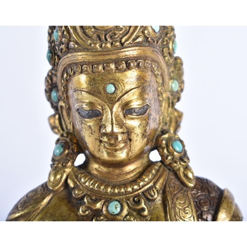 361 - AN 18TH CENTURY TIBETAN PARTIAL GILT BRONZE FIGURE OF A BUDDHA modelled upon a lotus capped base. 19... 