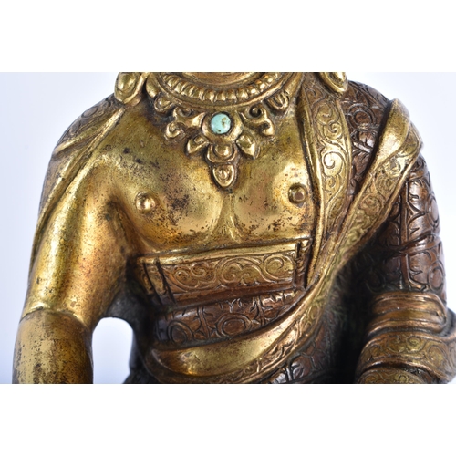 361 - AN 18TH CENTURY TIBETAN PARTIAL GILT BRONZE FIGURE OF A BUDDHA modelled upon a lotus capped base. 19... 