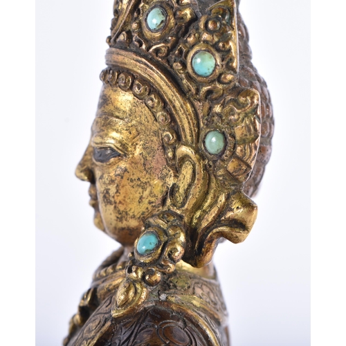 361 - AN 18TH CENTURY TIBETAN PARTIAL GILT BRONZE FIGURE OF A BUDDHA modelled upon a lotus capped base. 19... 