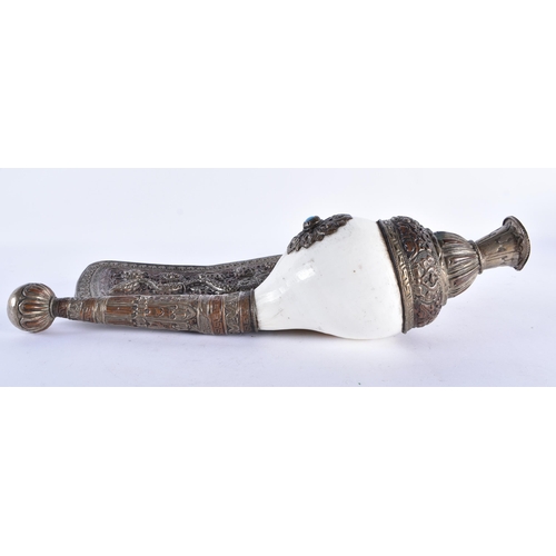 367 - A LARGE 19TH CENTURY TIBETAN REPOUSSE DRAGON HORN decorated in relief with foliage. 34 cm wide.