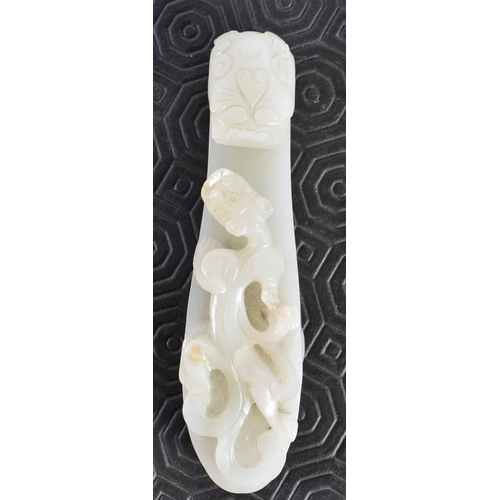 383 - AN 18TH CENTURY GREENISH WHITE JADE BELT HOOK Qing. 12.5 cm long.