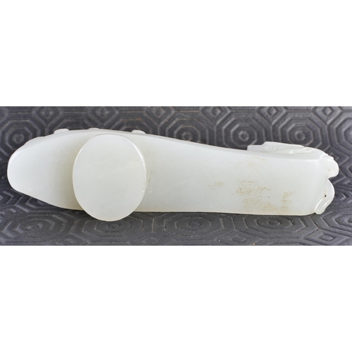 383 - AN 18TH CENTURY GREENISH WHITE JADE BELT HOOK Qing. 12.5 cm long.