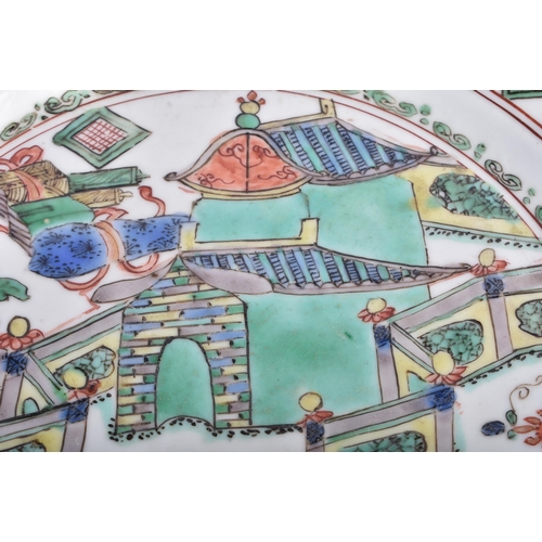 384 - A 17TH CENTURY CHINESE FAMILLE VERTE PORCELAIN PLATE Kangxi, painted with figures within landscapes.... 