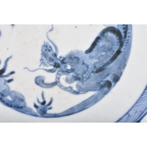 389 - AN 18TH CENTURY JAPANESE EDO PERIOD BLUE AND WHITE PORCELAIN DRAGON PLATE together with two Satsuma ... 