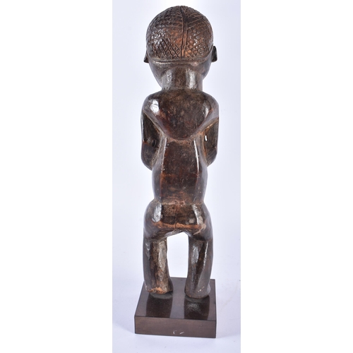 402 - AN AFRICAN TRIBAL CARVED WOOD FEMALE FIGURE Congo. 37 cm high.