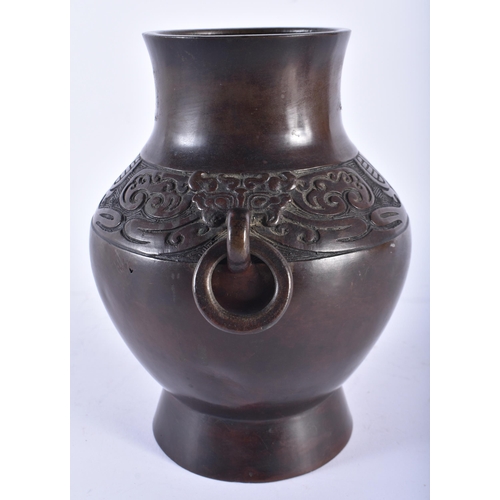 404 - A 19TH CENTURY CHINESE TWIN HANDLED BRONZE VASE Late Qing. 21 cm x 15 cm.