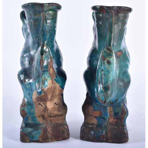 405 - A PAIR OF 17TH/18TH CENTURY CHINESE TURQUOISE GLAZED BEASTS Ming/Qing. 17 cm high.