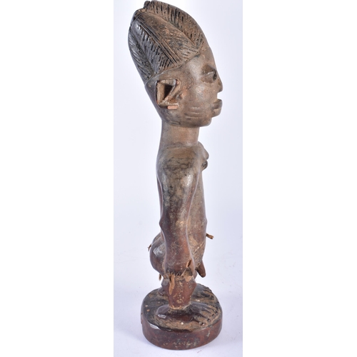 408 - AN AFRICAN TRIBAL AFRICAN CARVED WOOD YORUBA FIGURE Nigeria. 28 cm high.