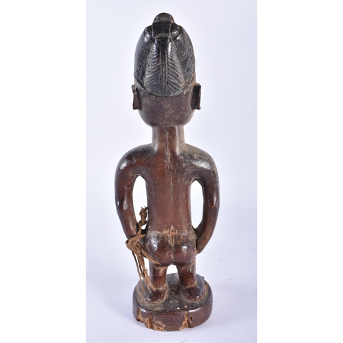 408 - AN AFRICAN TRIBAL AFRICAN CARVED WOOD YORUBA FIGURE Nigeria. 28 cm high.