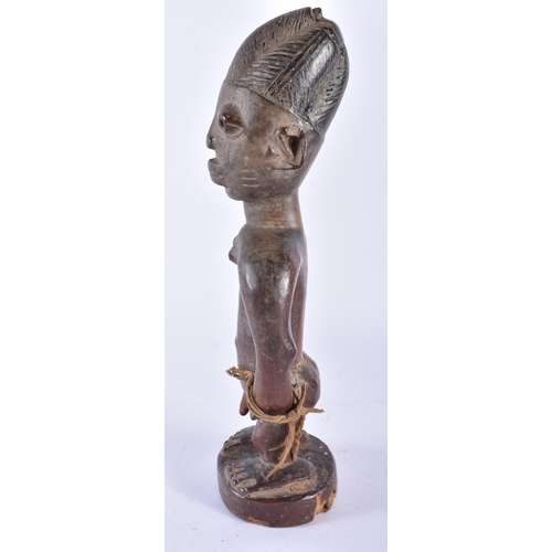 408 - AN AFRICAN TRIBAL AFRICAN CARVED WOOD YORUBA FIGURE Nigeria. 28 cm high.