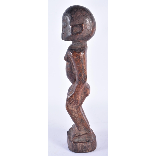 409 - AN AFRICAN TRIBAL WEST AFRICAN CARVED WOOD FON FIGURE Benin. 37 cm high.