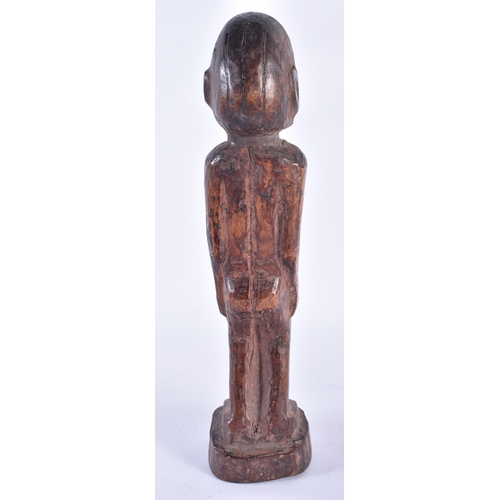 409 - AN AFRICAN TRIBAL WEST AFRICAN CARVED WOOD FON FIGURE Benin. 37 cm high.