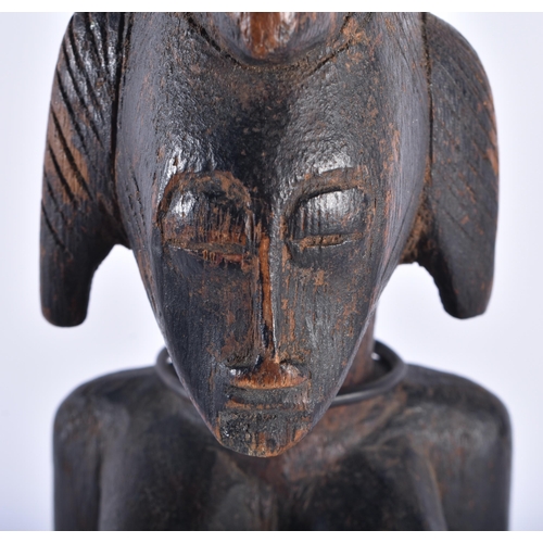 415 - AN AFRICAN SENUFO CARVED WOOD TRIBAL FIGURE Ivory Coast. 34 cm high.