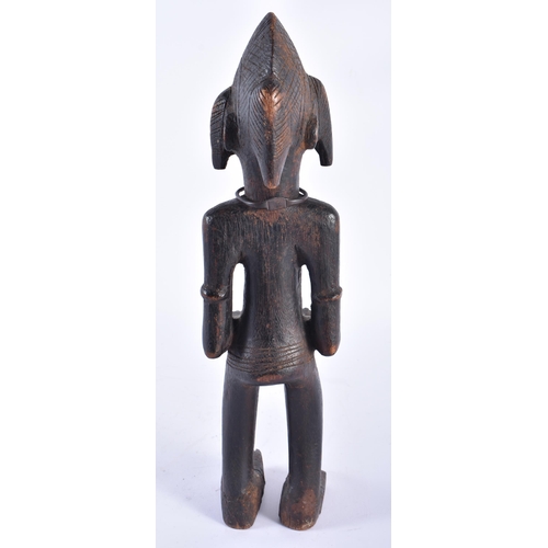 415 - AN AFRICAN SENUFO CARVED WOOD TRIBAL FIGURE Ivory Coast. 34 cm high.