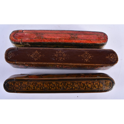 418 - THREE 19TH CENTURY MIDDLE EASTERN PERSIAN QAJAR LACQUER PEN CASES. 24 cm long. (3)