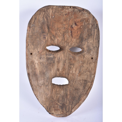 419 - A NEPALESE CARVED WOOD TRIBAL MASK. 28 cm x 14 cm.