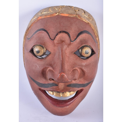 423 - TWO VINTAGE JAVANESE PAINTED WOOD MASKS. 21 cm x 14 cm. (2)