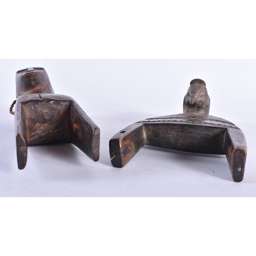 424 - TWO WEST AFRICAN TRIBAL CARVED WOOD PULLEYS. 18 cm long. (2)