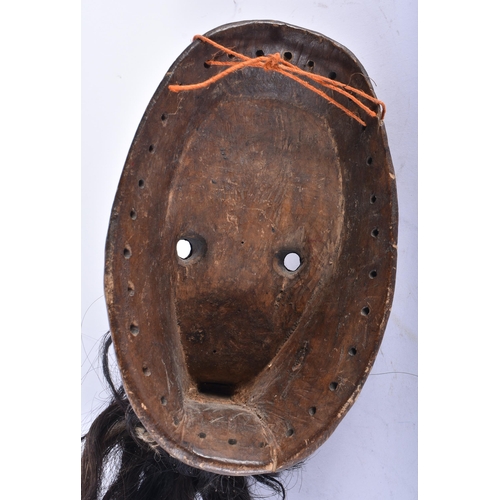 425 - AN AFRICAN TRIBAL CARVED WOOD DAN MASK Liberia. 26 cm x 16 cm.