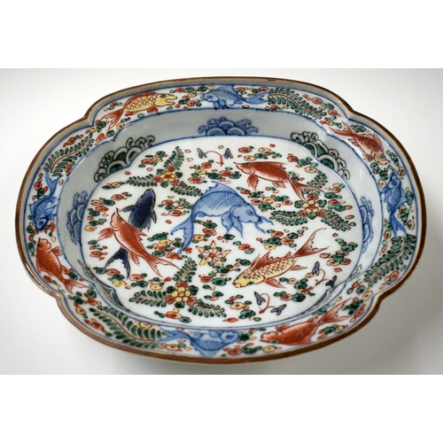 446 - A 19TH CENTURY CHINESE WUCAI PORCELAIN FOOTED DISH bearing Wanli marks to base. 24 cm x 22 cm.