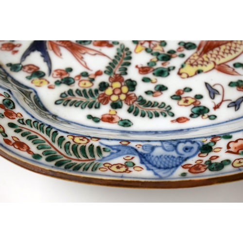 446 - A 19TH CENTURY CHINESE WUCAI PORCELAIN FOOTED DISH bearing Wanli marks to base. 24 cm x 22 cm.