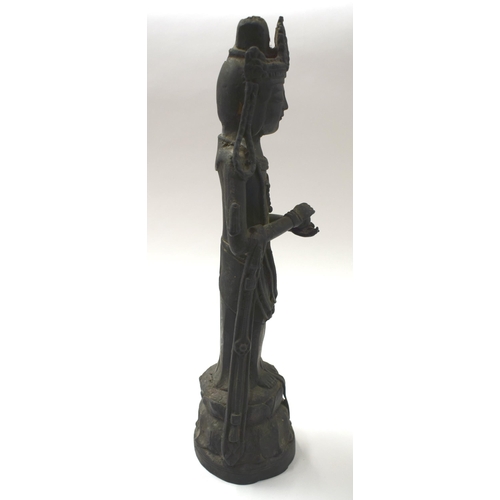 452 - AN UNUSUAL 18TH/19TH CENTURY CHINESE KOREAN BRONZE BUDDHA modelled with hands clasped. 38 cm high.