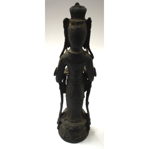 452 - AN UNUSUAL 18TH/19TH CENTURY CHINESE KOREAN BRONZE BUDDHA modelled with hands clasped. 38 cm high.