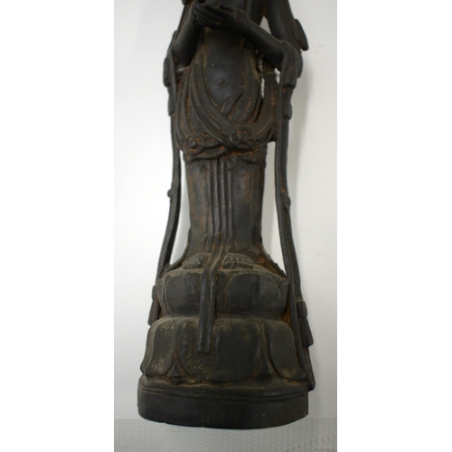 452 - AN UNUSUAL 18TH/19TH CENTURY CHINESE KOREAN BRONZE BUDDHA modelled with hands clasped. 38 cm high.