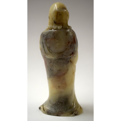 458 - A CHINESE QING DYNASTY SOAPSTONE IMMORTAL together with an ink cake etc. Largest 14 cm high. (4)