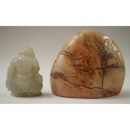 492 - A 19TH CENTURY CHINESE CARVED SOAPSTONE MOUNTAIN BOULDER Qing, together with a jade man. Largest 10 ... 