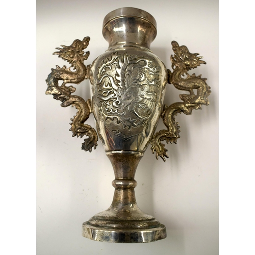 495 - A 19TH CENTURY CHINESE WHITE METAL TWIN HANDLED DRAGON VASE Late Qing. 32 cm x 18 cm.