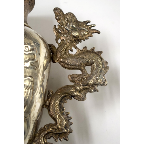 495 - A 19TH CENTURY CHINESE WHITE METAL TWIN HANDLED DRAGON VASE Late Qing. 32 cm x 18 cm.