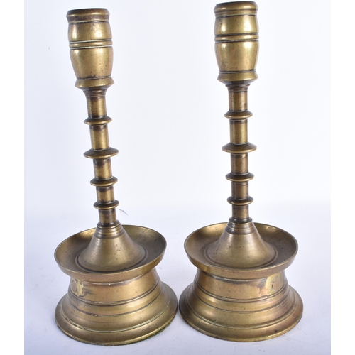 536 - A PAIR OF 17TH/18TH CENTURY GERMAN COPPER ALLOY CANDLESTICKS with tapered shaft and circular drip pa... 