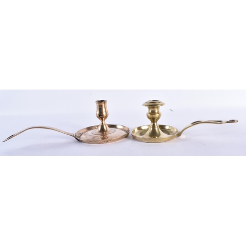 537 - TWO 18TH CENTURY BRASS CHAMBERSTICKS together with a pair of brass candlesticks. Largest 22.5 cm hig... 