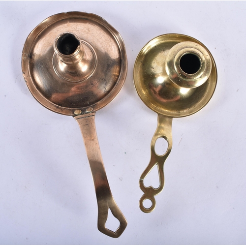 537 - TWO 18TH CENTURY BRASS CHAMBERSTICKS together with a pair of brass candlesticks. Largest 22.5 cm hig... 