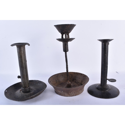 538 - FIVE EARLY CANDLESTICKS. Largest 35 cm high. (5)