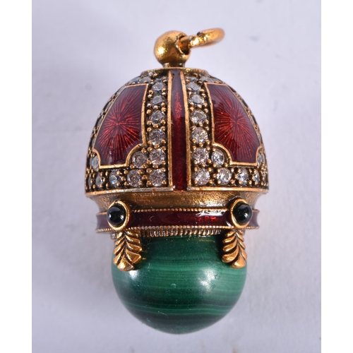 543 - AN ANTIQUE GOLD RUSSIAN RED ENAMEL DIAMOND AND MALACHITE EGG. 11 grams. 3.25 cm long.