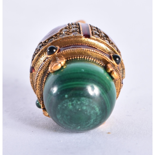 543 - AN ANTIQUE GOLD RUSSIAN RED ENAMEL DIAMOND AND MALACHITE EGG. 11 grams. 3.25 cm long.