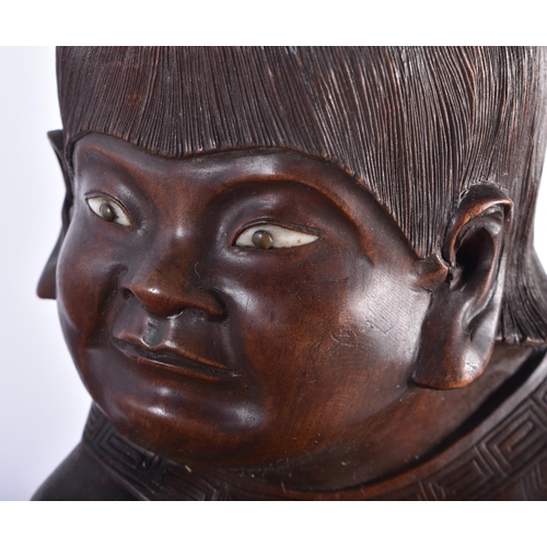 544 - A RARE AND UNUSUAL 19TH CENTURY JAPANESE MEIJI PERIOD CARVED WOOD OKIMONO modelled as a boy holding ... 