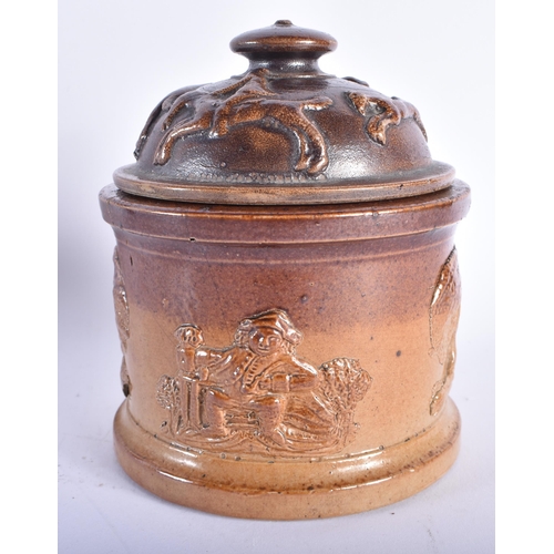 559 - AN UNUSUAL ANTIQUE ENGLISH STONEWARE MEAT POT AND COVER together with a painted armorial tin shield.... 