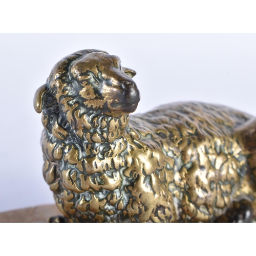 567 - AN 18TH CENTURY EUROPEAN BRONZE FIGURE OF A RECUMBENT LAMB modelled upon a stone base. 9.5 cm wide.