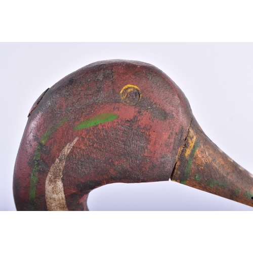 573 - AN EARLY SCANDINAVIAN FOLK ART PAINTED WOOD DUCK DECOY. 32 cm long.